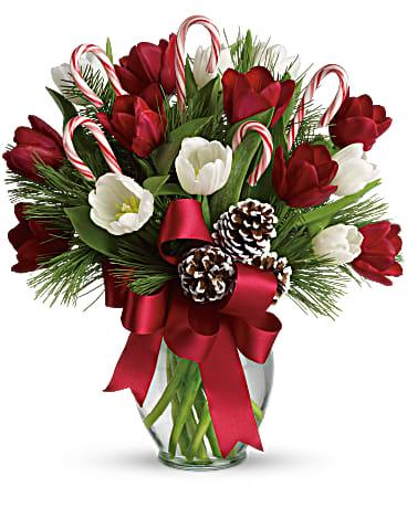 By Golly, Its Jolly Bouquet in a graceful clear glass vase.