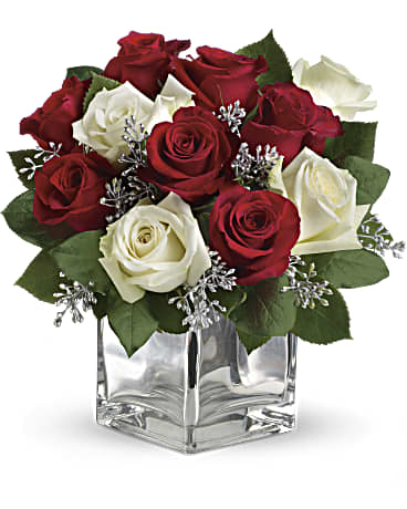 Snowy night bouquet arranged in a mirrored silver cube