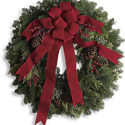 It's not Christmas without a fresh Christmas wreath on your door! Send the spirit of the season to someone special with this classic piece of holiday decor. The 24-inch wreath is composed of fragrant noble fir with touches of juniper and red berries, and is hand delivered by a local florist to ensure maximum freshness.
This 24-inch noble fir wreath is accented with juniper, red berries and pinecones and finished with a full red velvet bow.