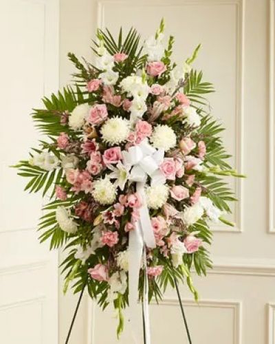 <p>This Profound Sympathies Standing Spray in shades of pink and white is a beautiful symbol of your sympathy and support. It is expertly crafted with pink roses, stargazer lilies, spray roses, white carnations and more. An appropriate gift for family, friends and business associates to send directly to the funeral home.</p>