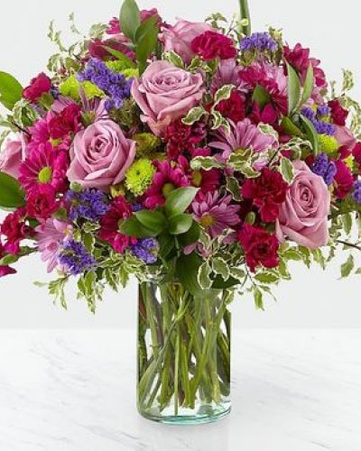 Dazzle your loved ones with stunning violet and green hues set within a glass cylinder vase. A collection of roses, daisies and statice, our Sweet Nothings Bouquet sends sweet sentiment deep within each bloom.

STANDARD
C Quantity Color Description
2 Lavender 50 cm Standard Rose
2 Green Button Pom
2 Lavender Daisy Pom
3 Purple Daisy Pom
3 Magenta Miniature Carnation
1 Purple Filler - Sinuata Statice
4 Green Green - Israeli Ruscus
2 Varigated Green - Pittosporum Italian

DELUXE

C Quantity Color Description
6 Lavender 50 cm Standard Rose
3 Green Button Pom
3 Lavender Daisy Pom
4 Purple Daisy Pom
4 Magenta Miniature Carnation
2 Purple Filler - Sinuata Statice
4 Green Green - Israeli Ruscus
2 Varigated Green - Pittosporum Italian

PREMIUM
C Quantity Color Description
8 Lavender 50 cm Standard Rose
4 Green Button Pom
4 Lavender Daisy Pom
5 Purple Daisy Pom
6 Magenta Miniature Carnation
3 Purple Filler - Sinuata Statice
6 Green Green - Israeli Ruscus
2 Varigated Green - Pittosporum Italian