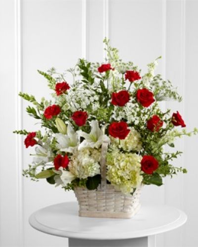 <p>The FTD® In Loving Memory™ Arrangement pays tribute to a life well-lived with every beautiful bloom. Red roses and carnations pop amongst this incredible arrangement of white hydrangea, Oriental lilies, snapdragons, larkspur, Queen Anne's Lace and assorted lush greens, lovingly arranged in a large whitewash rectangular basket to create an impressive display of caring kindness.</p>