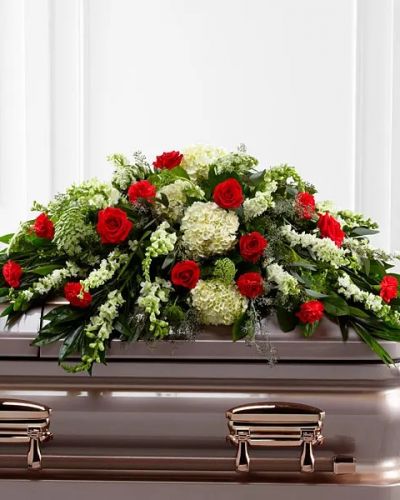 <p>The FTD® Sincerity™ Casket Spray is a wondrous presentation of fresh color and beauty. Rich red roses and carnations are eye-catching and elegant in an arrangement of white hydrangea, larkspur, snapdragons, Queen Anne's Lace and assorted lush greens to create a lovely display meant to bedeck the top of their casket, bringing comfort and peace to those grieving the loss of the departed.</p>