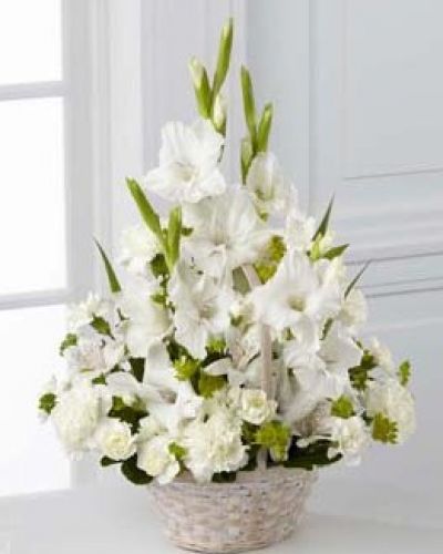 The FTD® Eternal Affection™ Arrangement is a peaceful offering of heartfelt sympathy. White gladiolus, Peruvian lilies, carnations, mini carnations and lush greens are beautifully arranged in a round whitewash handled basket to create a beautiful display of soft serenity.