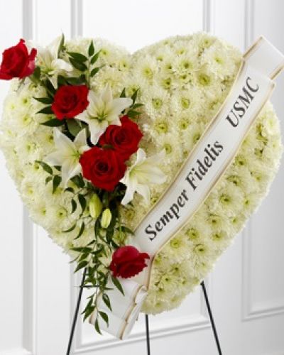Express your condolences with an arrangement that beautifully expresses comfort and honor within each bloom. Our Heartfelt Hero™ Standing Heart is made of a collection of cushion pompons, and accented with roses and lilies. To bring it all together, this breathtaking piece comes personalized with a printed ribbon.