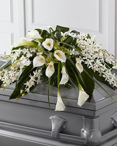 <p>The FTD® Angel Wings™ Casket Spray is an exceptionally gorgeous way to bring peace and beauty to their final farewell service. White Dendrobium orchids, white calla lilies, green hydrangea and a variety of lush greens are artfully arranged to perfectly adorn the top of their casket, offering the colors and ambience of grace and serenity.</p>