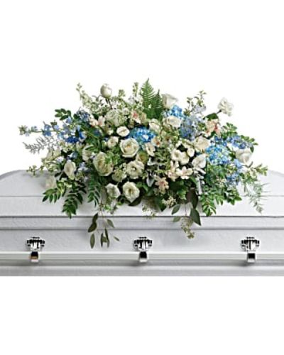 <div id="mark-1" class="m-pdp-tabs-marketing-description">

<hr />



<hr />

Like wisps of clouds in a bright blue sky, this breathtaking spray of hydrangea, roses and alstroemeria refreshes and inspires. A beautiful way to remember your loved one.

</div>
<div id="desc-1">
<ul>
 	<li>This stunning spray includes blue hydrangea, white roses, white spray roses, white alstroemeria, white lisianthus, blue delphinium, white larkspur, white stock, white waxflower, dusty miller, huckleberry, asparagus plumosus, pitta negra, lily grass, dagger fern, and lemon leaf.</li>
</ul>
</div>