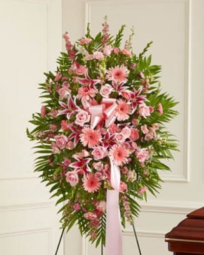<p>This Profound Sympathies Standing Spray in shades of pink is a beautiful symbol of your sympathy and support. It is expertly crafted with roses, stargazer lilies, larkspur, snapdragons and more. An appropriate gift for family, friends and business associates to send directly to the funeral home.</p>