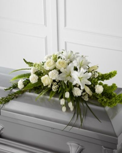 <p>The FTD® Resurrection™ Casket Spray inspires thoughts of comfort and peace to those wishing to pay their respects for the loss of the deceased. White tulips, roses, snapdragons, Oriental lilies, larkspur, carnations and monte casino asters are accented by the bright green stems of Bells of Ireland and an assortment of the finest lush greens to create the perfect arrangement to display on the top of their casket during their final farewell service.</p>