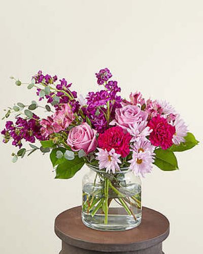 Send our Lollipop Bouquet as a sweet Mother's Day treat or to an unexpecting friend. Designed with berry hues that will brighten their day and fill their room with purple carnations, lavender roses and daisies. These happy stems are paired with beautiful eucalyptus for a stunning spring aesthetic.