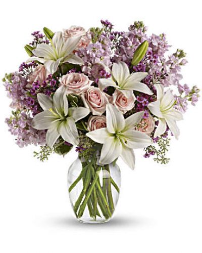 <div id="mark-3" class="m-pdp-tabs-marketing-description">Put your love into the season's most romantic flowers - light pink roses, fragrant white asiatic lilies and other favorites in a dazzling clear glass vase. Love will blossom in the most intoxicating way for a full week. You'll both enjoy it.</div>
&nbsp;
<div id="desc-3">
<ul>
 	<li>This spectacular bouquet includes light pink spray roses, white asiatic lilies, lavender stock and lavender waxflower accented with assorted greenery.</li>
</ul>
</div>