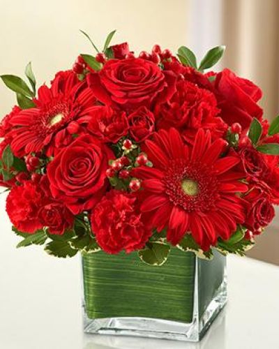 <p>A symbol of courage and strength, an all-red bouquet conveys your sympathies with striking beauty. Our florists fill a stylish cube vase with roses, spray roses, Gerberas, carnations and more to send a fitting tribute during times of sorrow.</p>