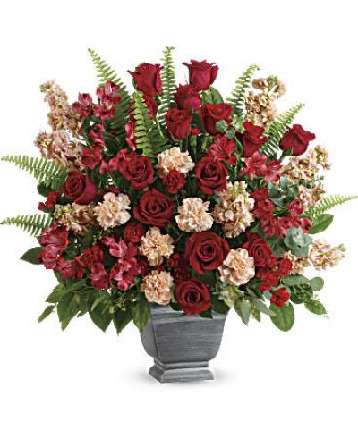 <div class="m-pdp-tabs-description">
<div id="mark-1" class="m-pdp-tabs-marketing-description">A bold expression of your deepest condolences, this elegant mix of red and peach blooms in a large antiqued pot brings strength and comfort.</div>
</div>
<p id="arrngDescp">Red roses, red alstroemeria, peach carnations, miniature red carnations, and peach stock are arranged with spiral eucalyptus, seeded eucalyptus, sword fern, and lemon leaf.</p>
