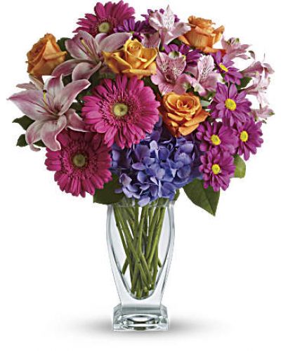 Featuring a wide, wondrous assortment of blooms in one bouquet, this colorful arrangement is always a favorite! Hydrangea, roses, lilies, alstroemeria, gerberas, daisies - they're all here in stunning variety.
This versatile mix includes blue hydrangea, orange roses, light pink asiatic lilies, pink alstroemeria, hot pink gerberas and purple daisies with a bit of rich green salal.