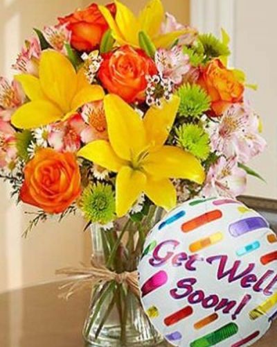 <p>Just what the doctor ordered! Inspired by the spectrum of color found in the rolling fields of Europe, our florists designed this gathering of fresh roses, lilies, alstroemeria, poms and more inside a stylish clear glass vase tied with raffia as a nod to rustic European style. Includes a "Get Well" 18" Mylar balloon.</p>