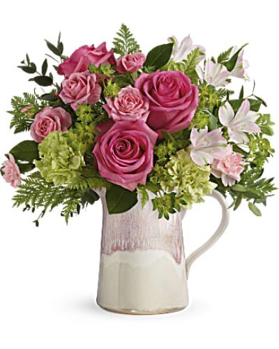 <div id="mark-3" class="m-pdp-tabs-marketing-description">Make their heart flutter with an extra special delivery! Hot pink roses and fresh greens look oh-so-chic in this stylish stoneware pitcher, featuring an iridescent reactive glaze in the prettiest shade of pink. It's food-safe for years of enjoyment!</div>
Hot pink roses, pink spray roses, light pink alstroemeria, green carnations and pink miniature carnations are arranged with bupleurum, leatherleaf fern, and parvifolia eucalyptus.