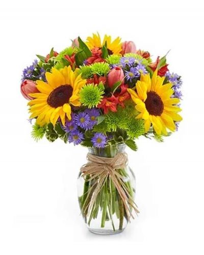 <p>The essence of a Europe garden comes to life in all its grandeur with this bright assortment of alstroemeria, button poms, Monte casino, sunflowers and tulips arranged in an elegant clear glass vase.</p>