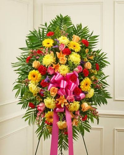 Crafted from fresh and brightly colored blooms, our heartfelt standing spray is a beautiful symbol of your love and support. Gathered with roses, lilies, Gerbera daisies, mums, snapdragons, alstroemeria, carnations and more, it conveys your deepest sympathies and lets them know they are in your thoughts. An appropriate expression of your sympathy for family, friends and business associates to send directly to the funeral home.