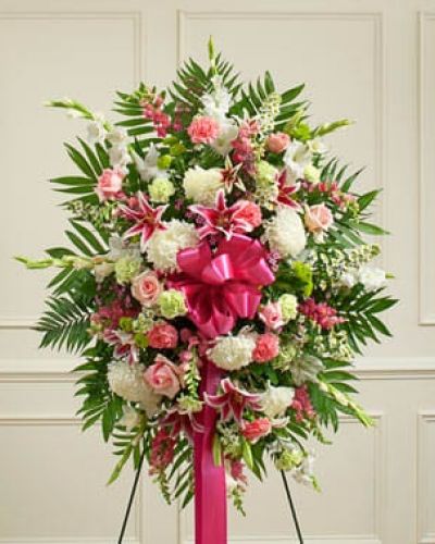 <p>Convey your deepest sympathies and continued support with this vibrant standing spray. Expertly crafted from an assortment of pastel blooms such as roses, lilies, mums, gladiolas, snapdragons, Bells of Ireland, carnations, heather and more, it's a comforting way to let them know that you're thinking of them during this difficult time. Appropriate for family, friends or business associates to send directly to the funeral home.</p>