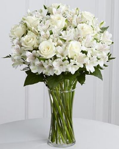 The FTD® Cherished Friend™ Bouquet offers comfort and sympathy in the time of grief and loss. Bright white roses and Peruvian lilies are accented by lush greens and gorgeously arranged in a clear glass gathering vase to create a bouquet that will bring peace and show how much you care.