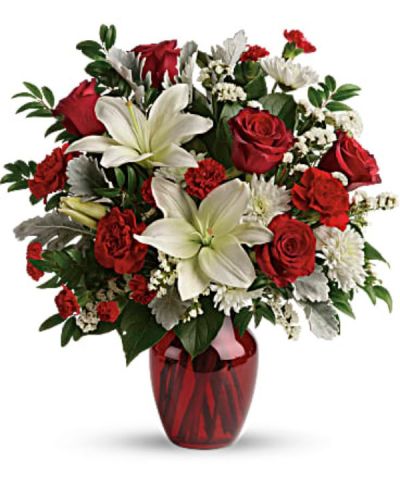 <div class="m-pdp-tabs-description">
<div id="mark-2" class="m-pdp-tabs-marketing-description">A vision of love! This luxe bouquet of fragrant white lilies and radiant red roses, hand-delivered in a ruby vase, is the perfect expression of your feelings.</div>
</div>
<p id="arrngDescp">This beloved bouquet includes red roses, white asiatic lilies, red carnations, red miniature carnations, white cushion spray roses, white sinuata statice, dusty miller, huckleberry, and lemon leaf. Delivered in a ruby rose vase.</p>