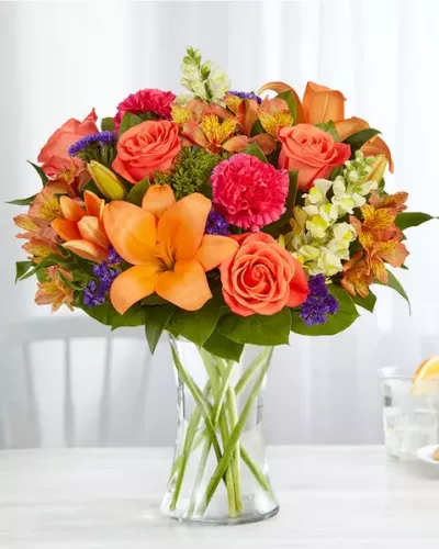 <p>Putting a bright start in somebody’s day starts with a beautiful gift. Our delightfully vibrant bouquet is filled with a medley of blooms in cheerful pops of orange, pink and yellow, with plenty of lush greenery mixed in. Designed by the talented Breanna Cartwright from Fresh Ideas Flowers Company in Modesto, California, it’s the perfect pick-me-up surprise, whatever the sentiment.</p>