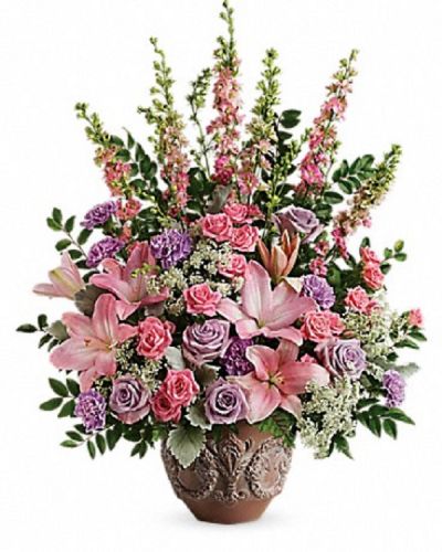 <div class="m-pdp-tabs-description">
<div id="mark-1" class="m-pdp-tabs-marketing-description">A touching tribute to a beloved woman, this beautiful, soft pink and lavender arrangement is presented in a large antiqued pot for an elegant touch.</div>
</div>
<p id="arrngDescp">This soft pink arrangement features lavender roses, pink spray roses, pink asiatic lilies, lavender carnations, pink larkspur, queen anne's lace, huckleberry, dusty miller, and leatherleaf fern.</p>