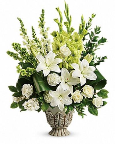 <div class="m-pdp-tabs-description">
<div id="mark-1" class="m-pdp-tabs-marketing-description">Peaceful and majestic in a large antiqued pot, this wondrous white arrangement is a touching tribute to a bright life, and your unending support.</div>
</div>
<p id="arrngDescp">White roses, white asiatic lilies, green gladioli, white carnations, bells of ireland, white snapdragons, and white stock are accented with myrtle, green ti leaves, and lemon leaf.</p>