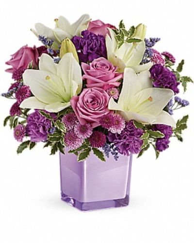 <div class="m-pdp-tabs-description">
<div id="mark-3" class="m-pdp-tabs-marketing-description">These luxurious lavender roses and crisp white lilies are poised to please! Perfectly presented in a stylish cube vase, it's an any-occasion surprise they'll never forget!</div>
</div>
<p id="arrngDescp">Lavender roses, white asiatic lilies, purple carnations, lavender carnations, purple button spray chrysanthemums and lavender button spray chrysanthemums are arranged with lavender limonium and pitta negra. Delivered in a glass cube.</p>