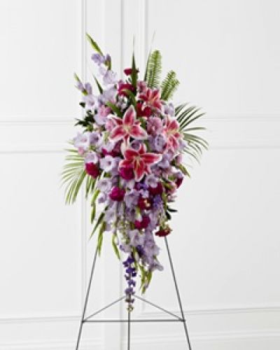 <p>The FTD® Tender Touch™ Standing Spray creates an elegant display of beauty and color to enhance their final tribute. Lavender gladiolus, Stargazer lilies, fuchsia carnations, purple larkspur, lavender Peruvian lilies, lavender chrysanthemums, sword fern fronds, emerald palm fronds and other assorted greens are gorgeously arranged to create a sophisticated standing spray. Displayed on a wire easel, this arrangement will add to the sophistication of their service with each fragrant bloom.</p>