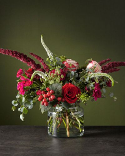 <p>Escape the cold with this wild Reverie bouquet, that's just bursting with white veronica and red upright amaranthus stems. Between the lively design and rustic-chic palette, every day with these blooms will bring new, upbeat energy.</p>