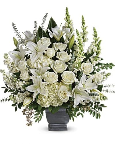 <div class="m-pdp-tabs-description">
<div id="mark-1" class="m-pdp-tabs-marketing-description">Like the sun on the horizon, this pure white bouquet of hydrangea, roses and lilies offers hope and inspiration.</div>
</div>
<p id="arrngDescp">White hydrangea, white roses, white oriental lilies, white snapdragons, and white stock are arranged with huckleberry, seeded eucalyptus, spiral eucalyptus, green ti leaves, and lemon leaf.</p>