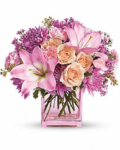 <div class="m-pdp-tabs-description">
<div id="mark-1" class="m-pdp-tabs-marketing-description">Impossibly pretty. This decidedly beautiful arrangement is absolutely delightful.</div>
</div>
<p id="arrngDescp">Perfectly peachy peach roses, pink asiatic lilies and miniature carnations, lavender cushion spray chrysanthemums and waxflower, pittosporum and seeded eucalyptus fill an glass cube. Have one delivered and almost anything's possible.</p>