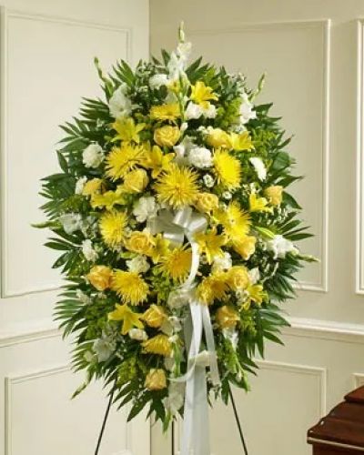 <p>Convey your care and concern with this beautiful standing spray arrangement of fresh yellow and white blooms signifying friendship and remembrance. This standing spray arrangement is expertly crafted using fresh yellow and white flowers such as roses, Asiatic lilies, gladiolas, carnations and more. Appropriate for family, friends or business associates to send directly to the funeral home.</p>