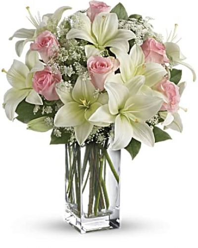 <div id="mark-3" class="m-pdp-tabs-marketing-description">Stunning in its simplicity, this innocent harmony of light pink roses and snow white lilies are a heartfelt way to send your very best. The classic, clear rectangular glass vase keeps the focus on the heavenly beauty of the blooms.</div>
&nbsp;
<div id="desc-3">
<ul>
 	<li>Light pink roses and white asiatic lilies form a fragrant bouquet with delicate touches of Queen Anne's lace and rich green salal.</li>
</ul>
</div>