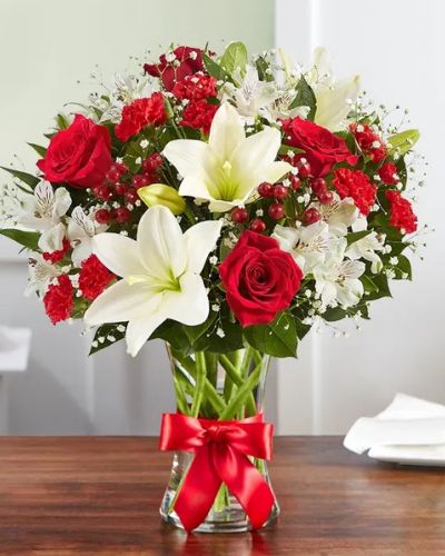 That feeling of bliss, captured in a bouquet. Inspired by the beauty of the European countryside, our best seller brings together radiant roses and lush lilies in a glass vase wrapped in red ribbon. Whatever your reason for reaching out, it’s a gift that delivers on delight.